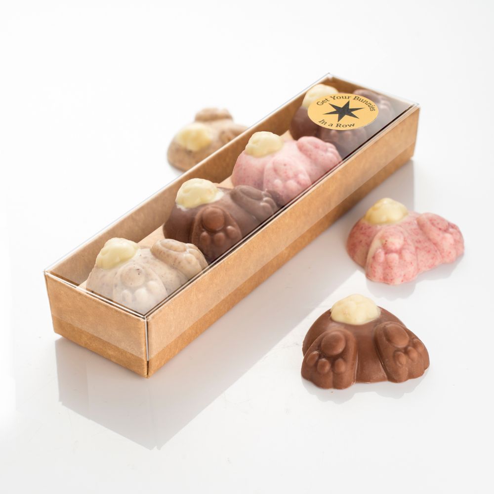 Each row is presented in a card tray with a clear plastic lid.